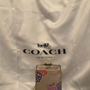 Coach Gold and Multicolor Floral Lanyard.